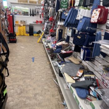 Dollar Tree - A store aisle with kitchen accessories, storage bags, and household items on shelves at Dollar Tree. - Discount Store Near Me - Springfield, Virginia
