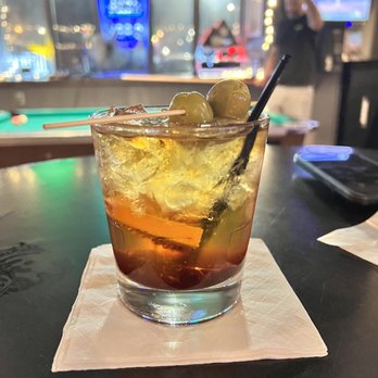 The Bar Next Door - a drink with olives in it - Burgers Near Me - Windsor, Wisconsin