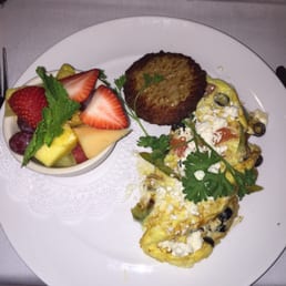 Greek Omelet, with sausage and fruit. Greek Omelet, with sausage and fruit.