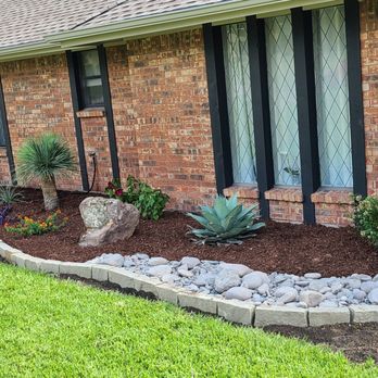Bloomscapes Design - a man watering a front yard - Landscaping Near Me Bloomscapes Design - a man watering a front yard - Landscaping Near Me