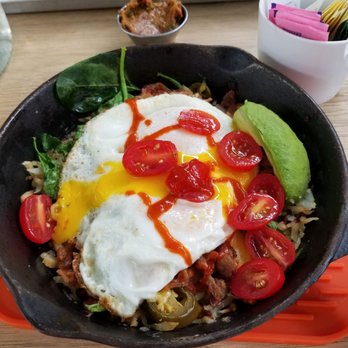 Social Kitchen & Bar - Skillet (hash browns, egg over easy, avocado, tomatoes, bacon, sriracha, spinach, and jalapenos) - New American Near Me - Birmingham, Michigan