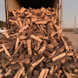 Freedom Firewood - Pinion Pine being unloaded.