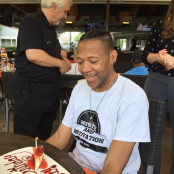 Tavola Restaurant + Bar - Ray Having Birthday Cheesecake With Strawberry Sauce - Bars Near Me - Springfield, Pennsylvania