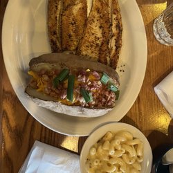 Cracker Barrel Old Country Store - Lemon pepper rainbow trout, loaded baked potato & Mac n cheese.