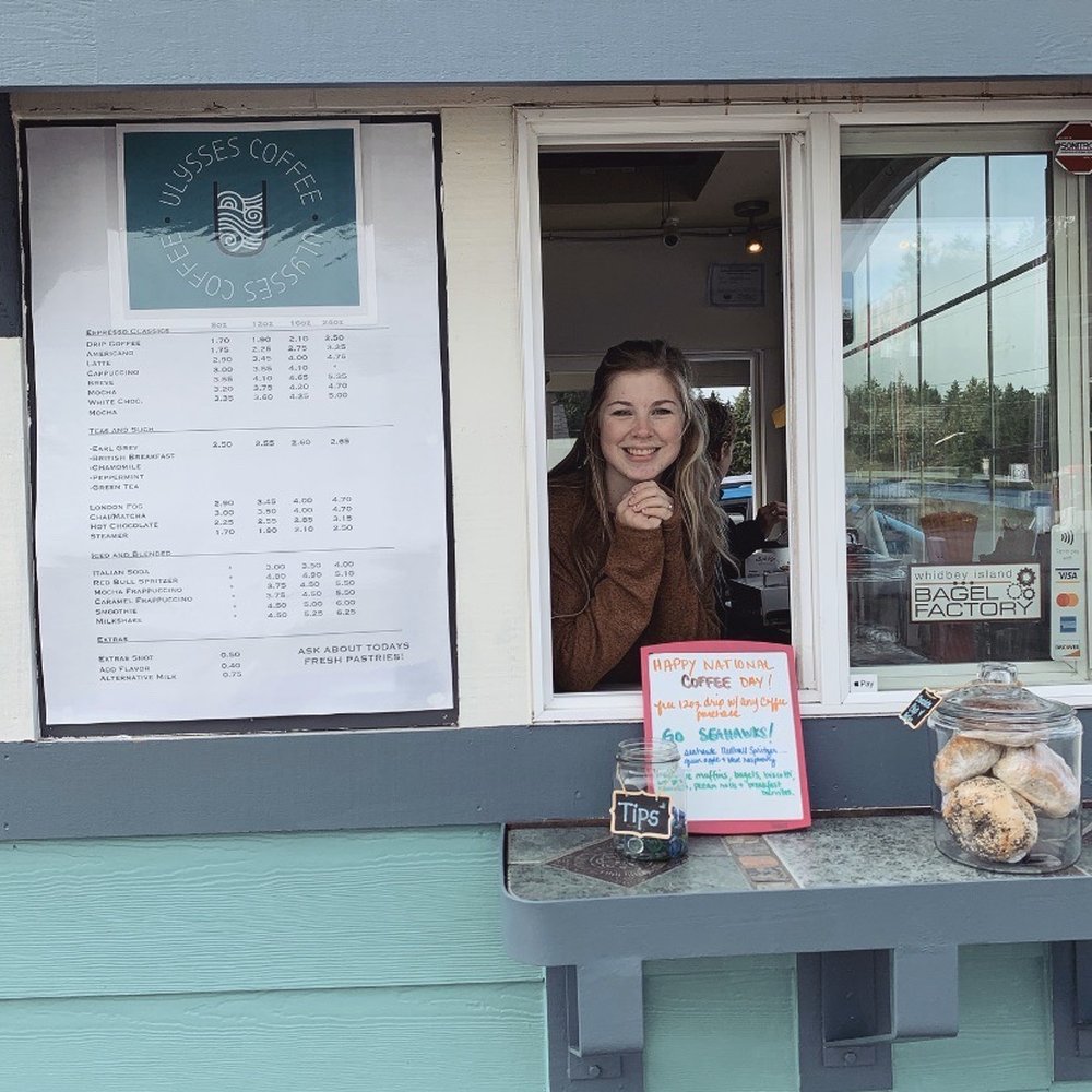 Ulysses Coffee - a woman looking out of a window - Coffee & Tea Near Me - Langley, Washington Ulysses Coffee - a woman looking out of a window - Coffee & Tea Near Me - Langley, Washington