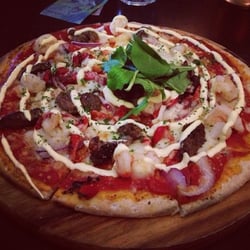 The Metz - Reef & Beef pizza. Lemon prawns, peppered beef, onion, capsicum & hollandaise sauce...