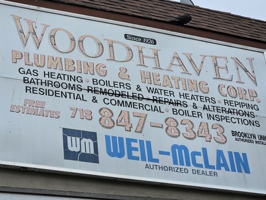 Woodhaven Plumbing & Heating Logo