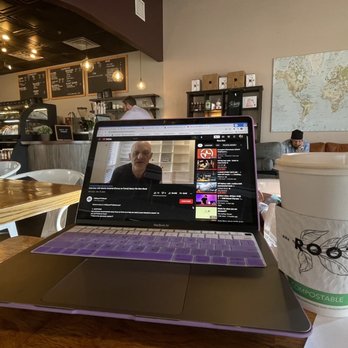 Roots Coffeehouse - a laptop and a cup of coffee - Coffee & Tea Near Me - North Richland Hills, Texas