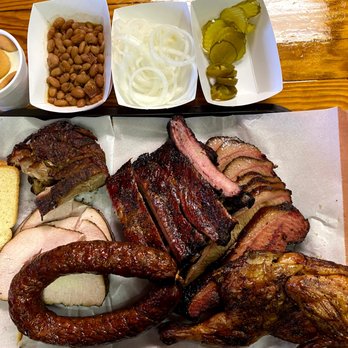 Snow's BBQ - The spread with a little of everything! - Barbeque Near Me - Lexington, Texas