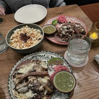 Arriba Abajo - The corn side (top left), carnitas and mushroom tacos - Mexican Near Me - Austin, Texas