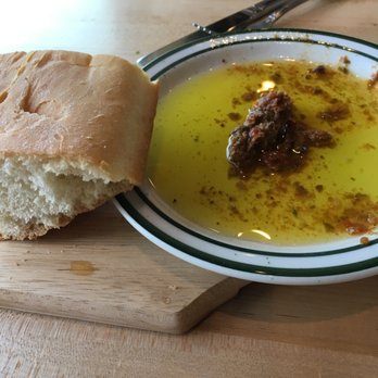 Mirabella's Table - Their bread with olive oil and sundried tomato tapenade. - Breakfast & Brunch Near Me - Rogers, Arkansas