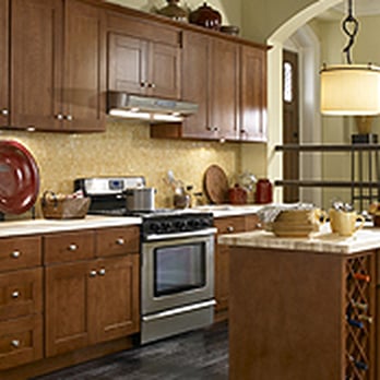 RCB Design + Build - a kitchen with wood cabinets and a wine rack - General Contractors Near Me RCB Design + Build - a kitchen with wood cabinets and a wine rack - General Contractors Near Me