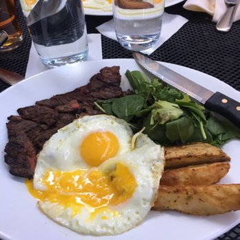 Verde on Smith - Delicious Steak (medium rare), sunny side up eggs, roasted potatoes and greens. - Italian Near Me - Brooklyn, New York Verde on Smith - Delicious Steak (medium rare), sunny side up eggs, roasted potatoes and greens. - Italian Near Me - Brooklyn, New York