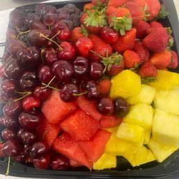 a tray of fresh fruit on a table a tray of fresh fruit on a table