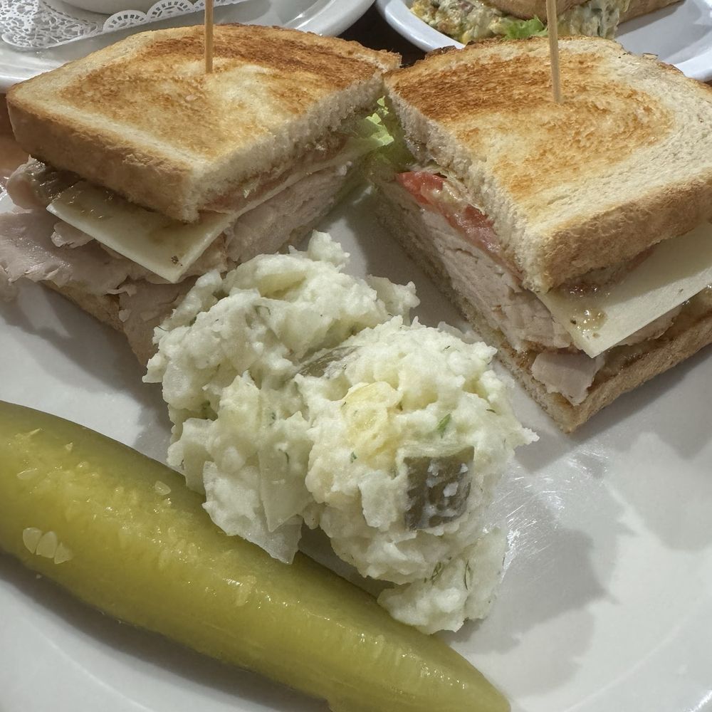 Custom sandwich: sour dough, turkey, swiss, pesto mayo, lettuce tomato