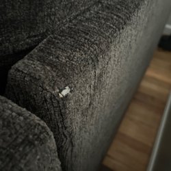Ashley Store - Hole in the new couch from them dragging it on the ground. I watch the delivery guys dragging