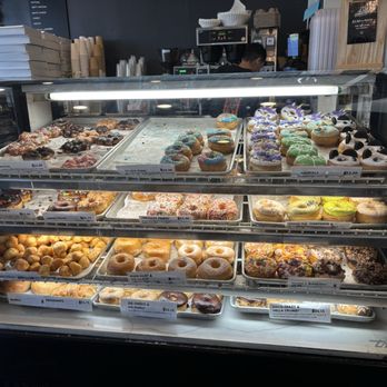 Dynamite Donuts - Display case of donuts. The animal donuts were super cute too. - Donuts Near Me - Hercules, California