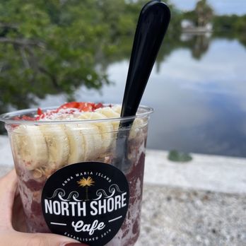 North Shore Cafe - a hand holding a cup of ice cream - Coffee & Tea Near Me - Anna Maria, Florida North Shore Cafe - a hand holding a cup of ice cream - Coffee & Tea Near Me - Anna Maria, Florida