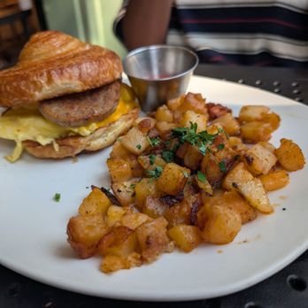 Billy Hicks - Bfast Sandie. I think the croissant is too buttery for a greasy sandwich, but it was still pretty tasty. And the potatoes are delicious - American Near Me - Washington, DC, District of Columbia