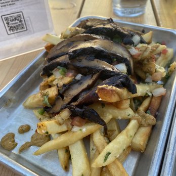 Switchback - Garlic fries with cashew cream sauce and portobello mushroom as the protein. - Tacos Near Me - Durango, Colorado Switchback - Garlic fries with cashew cream sauce and portobello mushroom as the protein. - Tacos Near Me - Durango, Colorado