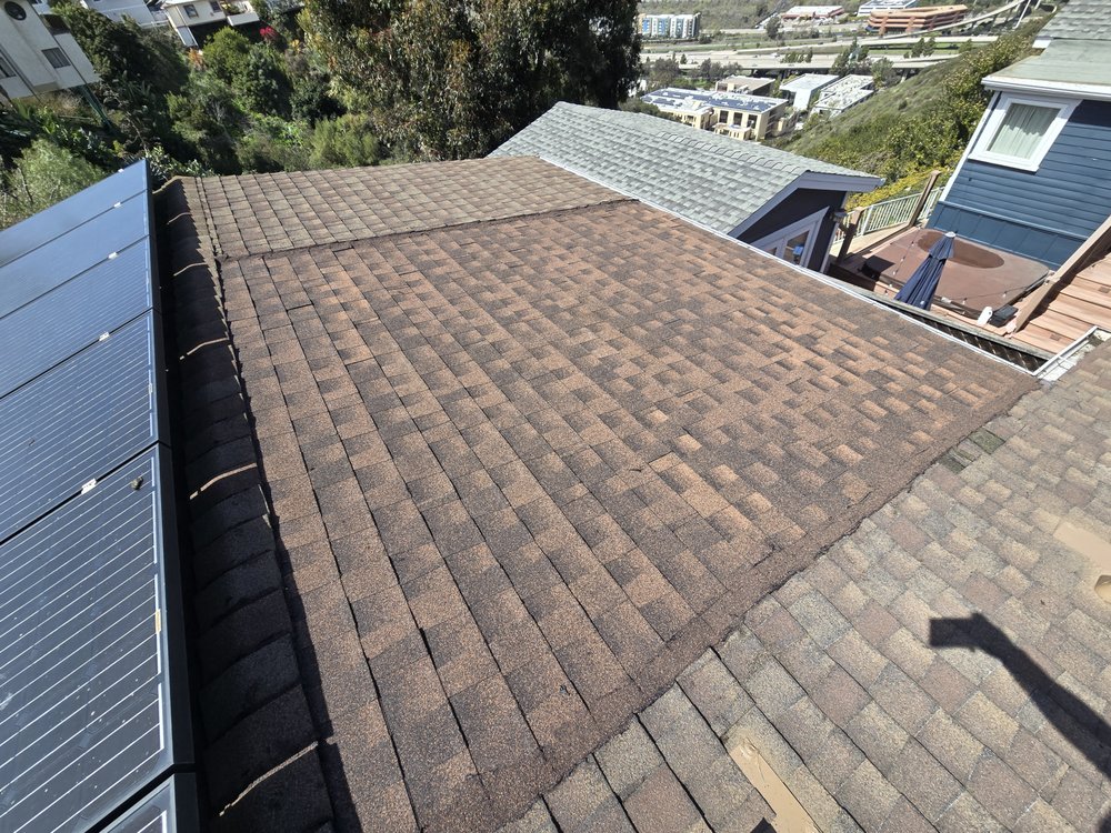 Slide of J&E Roofing Services