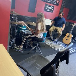 Lola getting drum lessons from Wes at Staump Music School