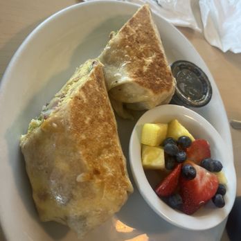 The Waffle Place - This was my my friend breakfast which was breakfast burrito with side of fruit - Breakfast & Brunch Near Me - Fresno, California The Waffle Place - This was my my friend breakfast which was breakfast burrito with side of fruit - Breakfast & Brunch Near Me - Fresno, California