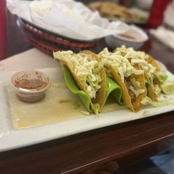 Tacos Rojas - Three tacos with shredded cheese