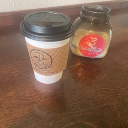 Sweet Latte treat and espresso bar - Medium sized latte with decor in the background