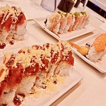 J Sushi Orange - Salmon on California Roll Oh My Garlic Roll Red Dragon Roll - Sushi Bars Near Me - Orange, California
