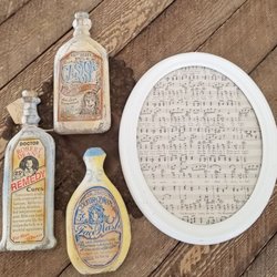 Vintage Revival - How cute are these wood bottle replicas with old style lables?!? The framed sheet music is "My Old Kentucky Home".