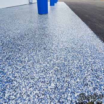 Paradigm Concrete Finishes - a close up of a blue concrete driveway - Flooring Near Me - Sarasota, Florida