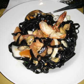 Santa Lucia Limmatplatz - Squid ink pappardelle with baby squid and mixed seafood. - Italian Near Me - Zürich, ZH Santa Lucia Limmatplatz - Squid ink pappardelle with baby squid and mixed seafood. - Italian Near Me - Zürich, ZH
