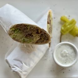 City Kebabs And Gyros - Wrap Marinated lamb and beef, slow-cooked and thinly sliced. with Salad, Hummus & Sauce Inside.