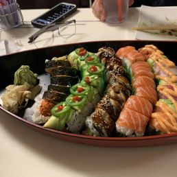 Rainbow Roll, 8-Men Roll, Arizona Roll, Spicy Salmon Roll Rainbow Roll, 8-Men Roll, Arizona Roll, Spicy Salmon Roll