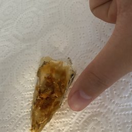 Cut open ear candle with ear wax inside