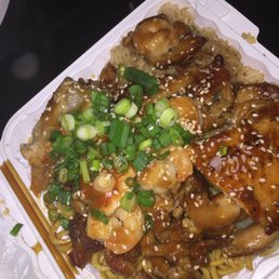 Chicken, shrimp and salmon hibachi with half fried rice half noodles and steamed vegetables Chicken, shrimp and salmon hibachi with half fried rice half noodles and steamed vegetables