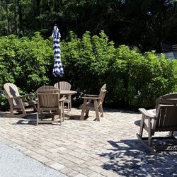 Clearwater / Lake Tarpon KOA Holiday - Fire pt/chairs and picnic table.