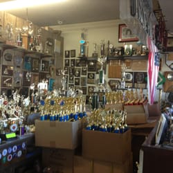 G & W Custom Awards - Little shop - full of trophies waiting for pick up!