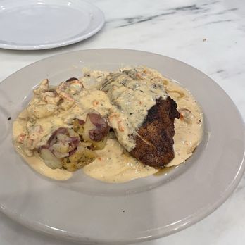 New Orleans Food & Spirits - Blackened stuffed red fish with crawfish sauce and crab boiled potatoes with sauce. - Seafood Near Me - Covington, Louisiana