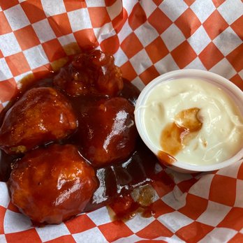 Hobie's Sports Den - a bowl of sauce and chicken wings - Sports Bars Near Me - Plattsburgh, New York