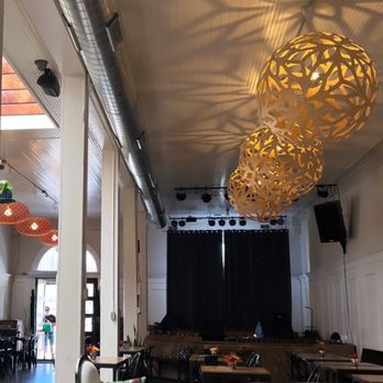 Meridian - a view of a large room with tables and chairs - Coffee & Tea Near Me - Buda, Texas