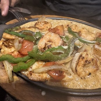 La-Cabana Mexican Cantina & Grill - This plate came to my husband sizzling tasty hot! - Mexican Near Me - Grenada, Mississippi