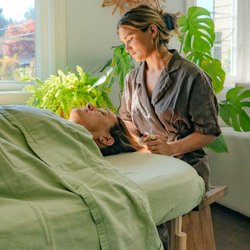Evoke Acupuncture and Wellness - Relax, during a facial rejuvenation session.