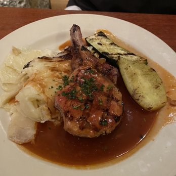 River Grill - Grilled pork chop, bone-in, gratin potatoes, grilled squash, bourbon bbq sauce - New American Near Me - Tahoe City, California
