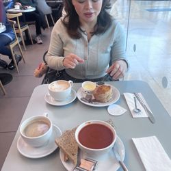 John Lewis - Breakfast of a scone with clotted cream and strawberry conserve, tomato soup with toasted bloomer and two café lattes