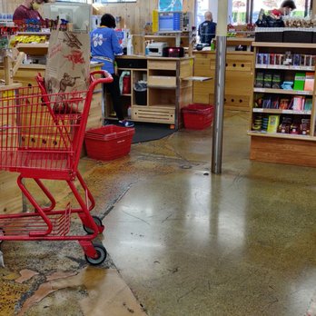 Trader Joe's - (May 2020) Customer must stand six feet away while cashier is ringing her up. - Grocery Near Me - Culver City, California Trader Joe's - (May 2020) Customer must stand six feet away while cashier is ringing her up. - Grocery Near Me - Culver City, California