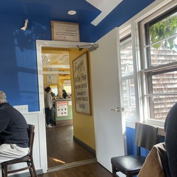Estia's Little Kitchen - a man sitting at a table - Breakfast & Brunch Near Me - Sag Harbor, New York Estia's Little Kitchen - a man sitting at a table - Breakfast & Brunch Near Me - Sag Harbor, New York