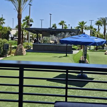 PopStroke - Right before Hole 1 on either course is a practice hole and a full bar!! Let the fun begin? - Mini Golf Near Me - Paradise, Nevada