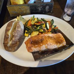 Niko's Tavern - Elgin - Cedar plank salmon with baked potato